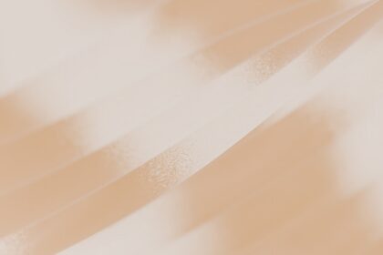 A blurry photo of a person holding a cell phone